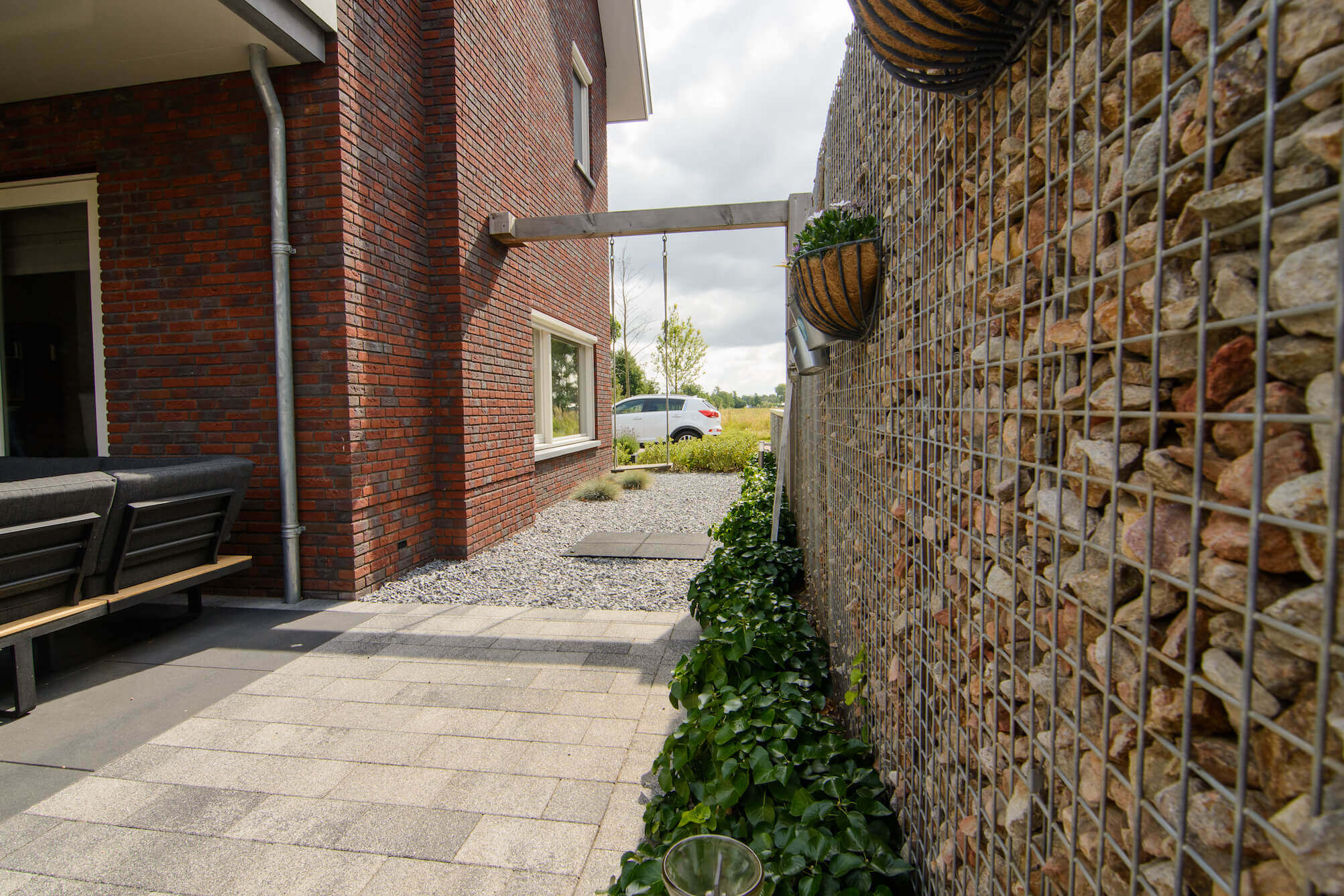Hedera schutting maken - Hoveniersbedrijf van den Heuvel